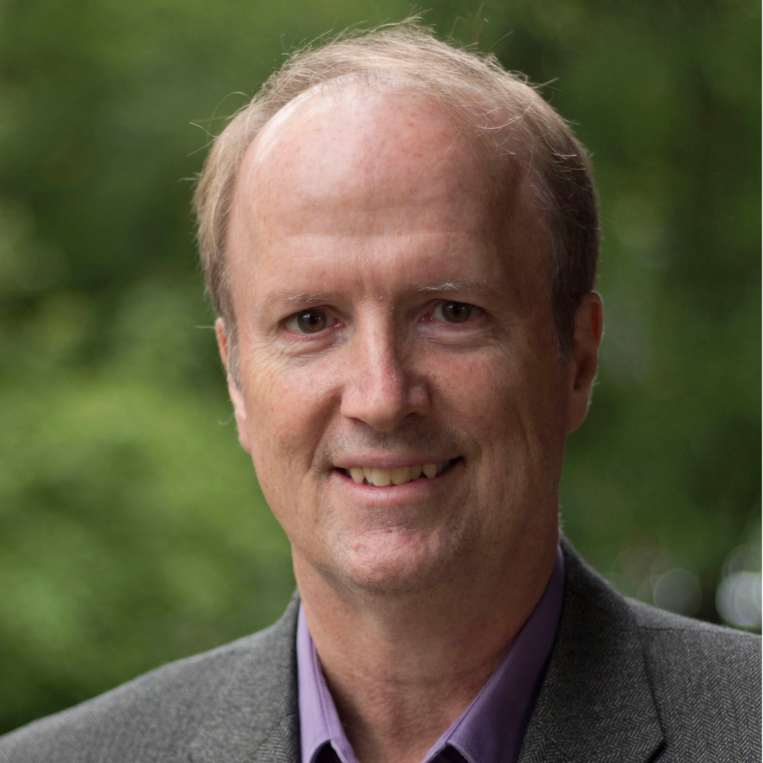 This is a hidden image of a professional head shot of Christopher Rutty